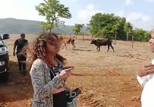 X/@tweets_prateekg
 : Puja Khedkar's mother is in the limelight now over a purported old video of her going viral, showing her yelling at a man while waving a pistol.

